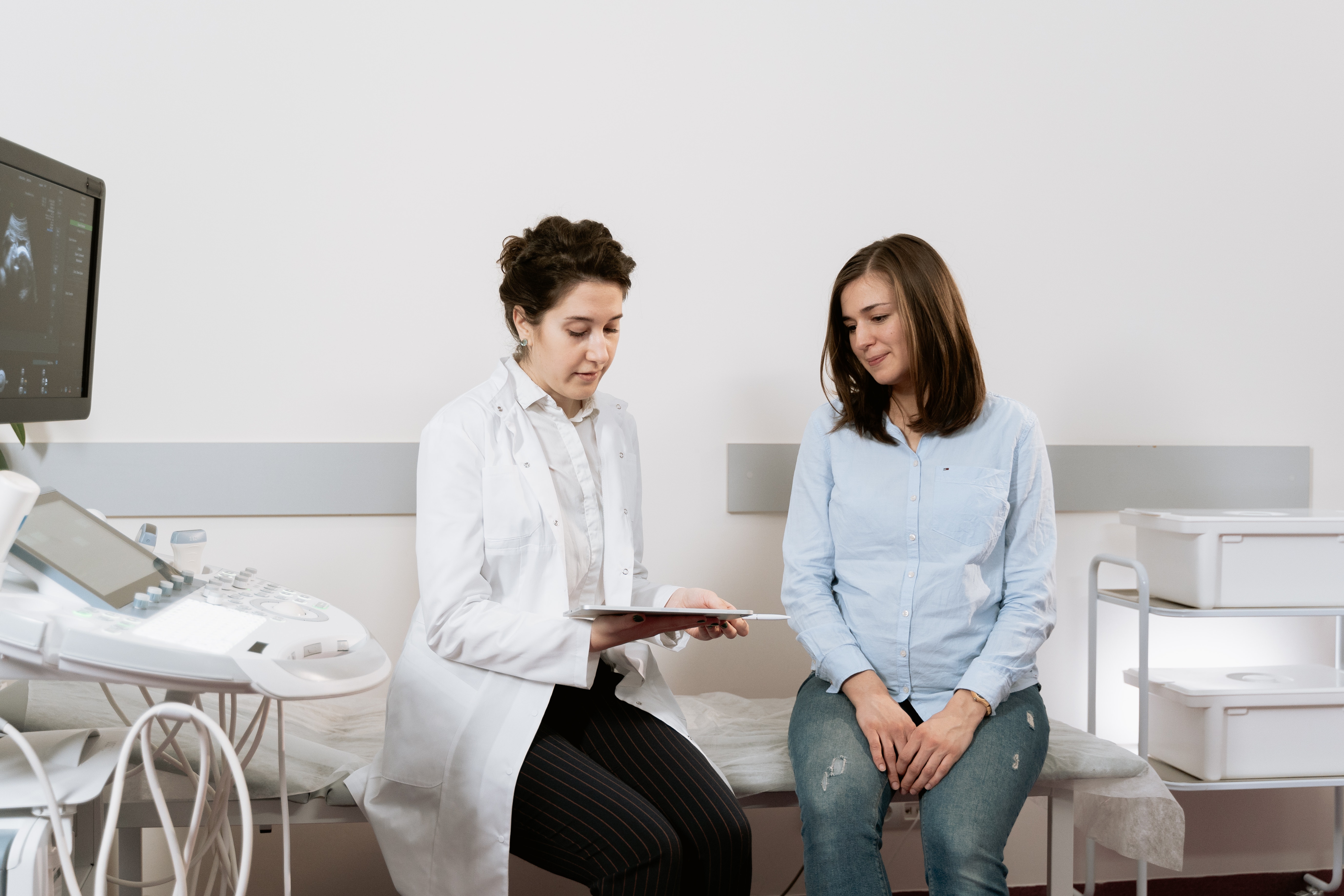 A pregnant woman consulting with her doctor